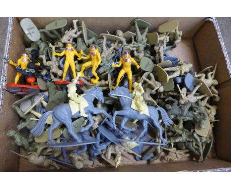 A box containing various 1:32 scale Airfix figures 