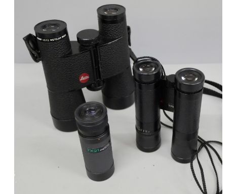 Two pairs of Leitz Trinovid compact binoculars and a Pentax 7x21 monocular, with soft cases