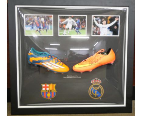 A Lionel Messi and Cristiano Ronaldo dual signed boot presentation with Superstars CoA 