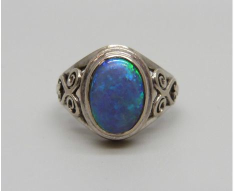 A white metal and opal ring, L