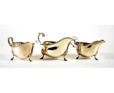 A Silver Sauce Boat of George III Style, George Howson, Sheffield 1926, with gadroon rim on shell pad feet; and A Pair of Sil