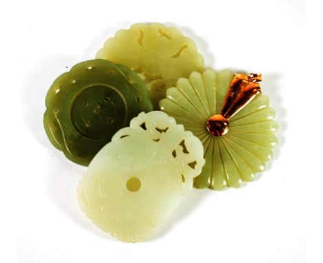 A Chinese Jade Disk, with central rotating section, 5.5cm diameter; A Similar Disk, carved and pierced as two butterflies, 6c