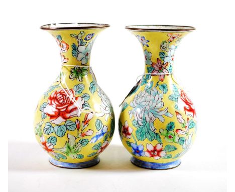 A Pair of Canton Enamel Pear Shaped Vases, 19th century, with flared necks decorated with flowers on a yellow ground, 15.5cm 