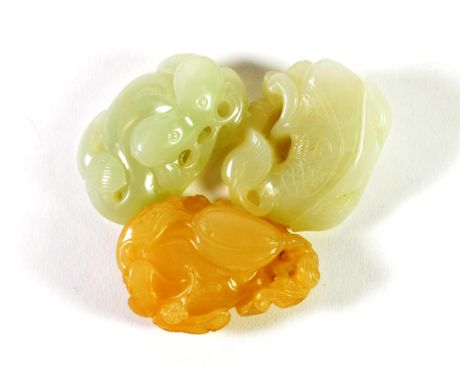 A Chinese Jade Carving, of a fruiting branch, 5cm long; and Two Similar Carvings, 4.5cm and 5cm long (3)