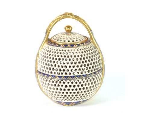 A Zsolnay, Pecs Style Earthenware Reticulated Vase and Cover, circa 1900, in Japanese style, of ovoid form with overhead hand