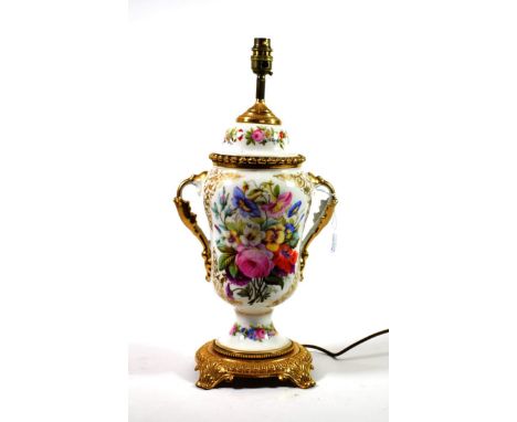 ~ A French Porcelain Twin-Handled Lamp Base, circa 1870, painted with flower sprays, 40cm high
