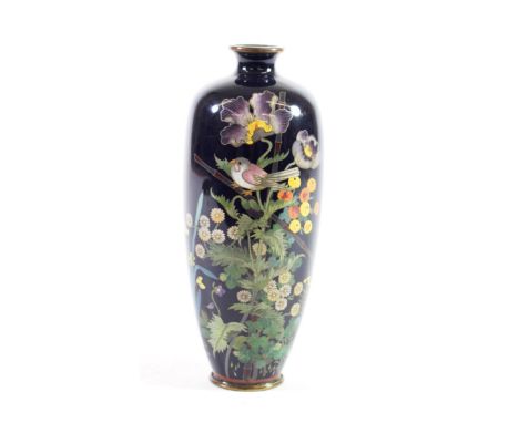 A Japanese Cloisonné Enamel Vase, Meiji period, of baluster form decorated with a bird amongst flowering branches on a midnig