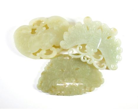 A Chinese Jade Plaque, carved and pierced as a moth, 9cm wide; A Similar Plaque, 9cm wide; and A Plaque, carved as a bat, 8cm