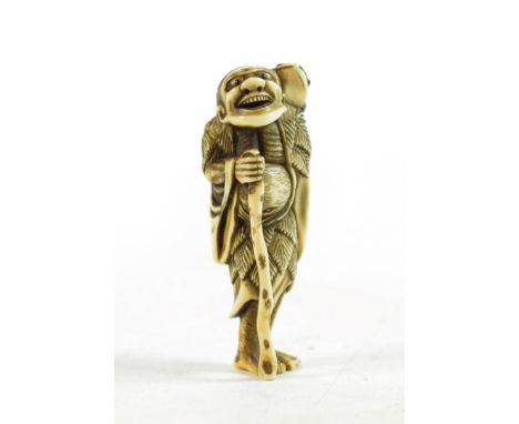 A Japanese Ivory Netsuke, Meiji period, in the form of a Gama Senin, with horn eyes, 6.5cm high 