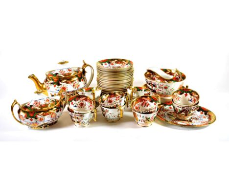 A Spode Porcelain Tea Service, circa 1820, painted in colours with an Imari design, comprising a teapot, cover and stand, suc