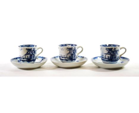 A Set of Three Lowestoft Porcelain Coffee Cups, circa 1770, painted in underglaze blue with a chinoiserie building in landsca
