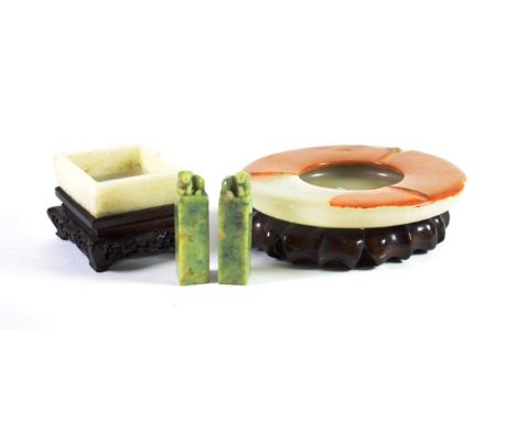 A Chinese Jade Square Bowl, carved with taotie, 6.5cm wide; A Pair of Seals, surmounted by mythical beasts, 7cm wide; and A C