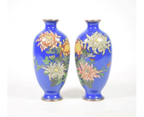 A Pair of Japanese Cloisonné Enamel Vases, Meiji period, of ovoid form, decorated with chrysanthemums on a blue ground, 18cm 