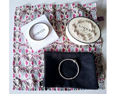 Links of London- A 3-strand silver bracelet with branded box and bag together with a Coeur de Lion white metal and crystal hi