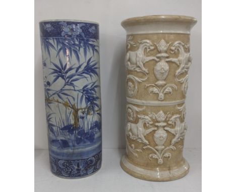A 19th century glazed pottery jardiniere decorated with relief moulded mythical beasts and scrolling foliage 63cm h , togethe