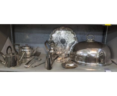 A selection of silver plated items to include a large meat dome, asparagus tongs, a teapot, chocolate pot, and other items Lo