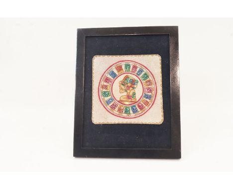 A Mayan style polychrome decorated suede panel, late 20th century, mounted in frame on easel support, 17 x 17cm Please refer 