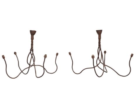 Designer Unknown, a pair of modern iron four light chandeliers, circa 2000, patinated iron, each 80cm high   It is the buyer'