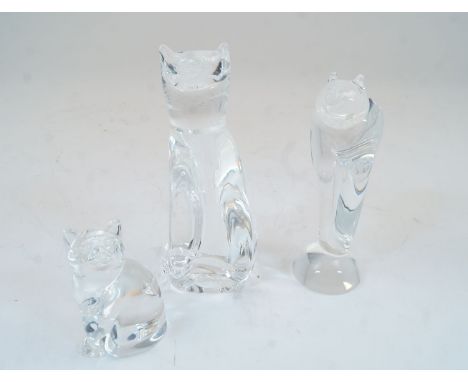 Three Steuben glass cats, 20th century, comprising two modelled seated and one on two legs, the tallest 22.5cm high (3)Please