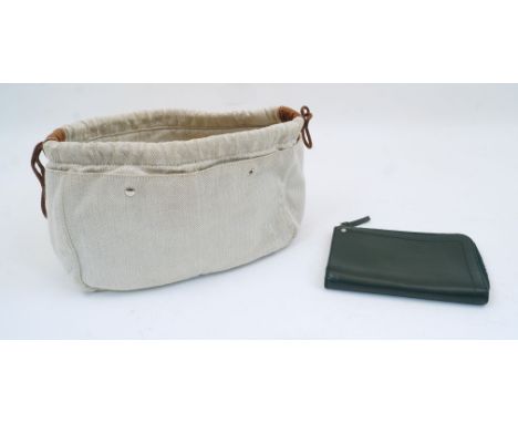 Hermes: a Fourbi 25 natural canvas and brown leather drawstring pouch bag, with Hermes label to the interior zipped compartme