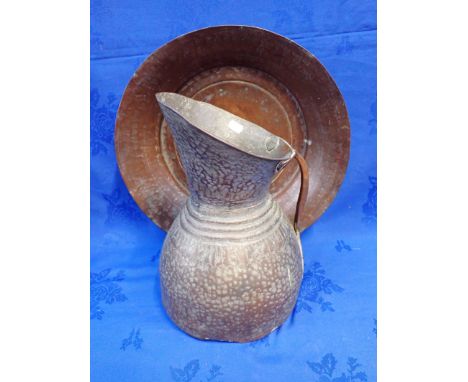A PERSIAN COPPER EWER AND BASIN the ewer 35cm high
