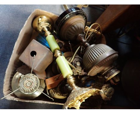 A COLLECTION OF OIL LAMP BASES a ceiling light shade and other similar items
