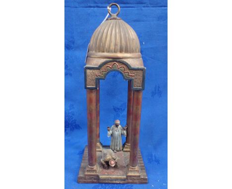 A SPELTER TABLEAU MOSQUE SCENE LAMP, THE LIGHT FITTING IN THE DOMED ROOF 38cm high 