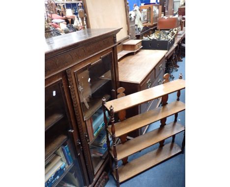 AN EDWARDIAN OAK GLAZED BOOKCASE 128cm wide, an Edwardian oak dressing chest (mirror glass missing), and a Victorian hanging 