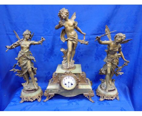 A FRENCH GILT SPELTER AND ONYX CLOCK GARNITURE the movement by W.B.K.Fils, Paris, striking in a bell, the clock and flanking 