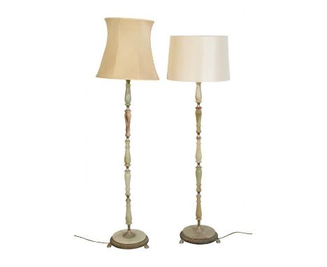 A NEAR PAIR OF ONYX STANDARD LAMPS the taller 129cm high, the other 128cm high (2). From The Estate of John Whitwell MS, FRCS