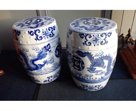 A PAIR OF CHINESE BLUE AND WHITE CERAMIC GARDEN SEATS circular, pierced and decorated with dragons