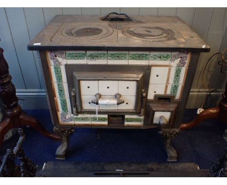 A CONTINTENTAL KITCHEN STOVE WITH CERAMIC TILE PANELS 72 x 59 x 71 cm 