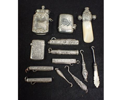 A COLLECTION OF SMALL SILVER and white metal, including button hooks, vestas and a teething rattle