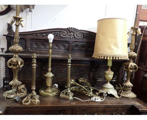 TWO PAIRS OF GILT TABLE LAMPS, OF NEOCLASSICAL STYLE the tallest 91cm high, a wall light, and other single lamps