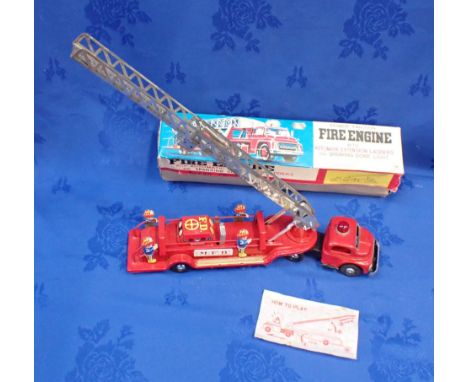 A VINTAGE JAPANESE TINPLATE TOY 'M.F.D.' FIRE ENGINE (BOXED) friction mechanism 'with automatic extension ladders and sparkin