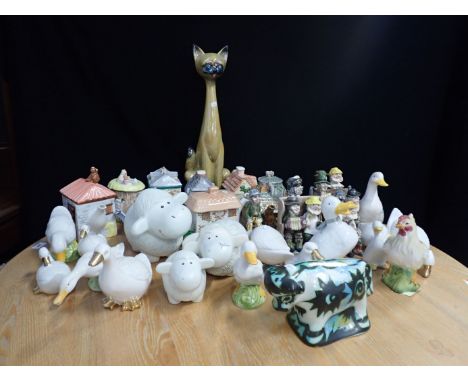 A CELTIC POTTERY BULL and a collection of novelty teapots, ceramic animals and other items 