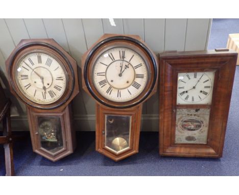 AN AMERICAN 'O.G' CASED WALL CLOCK by E. N. Welch, with American eagle door transfer, and two American drop-dial clocks (3)