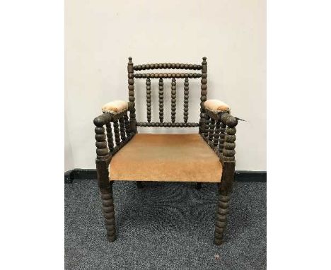 An oak bobbin armchair 