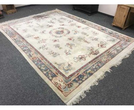 A Chinese carpet on cream ground 376cm by 276cm