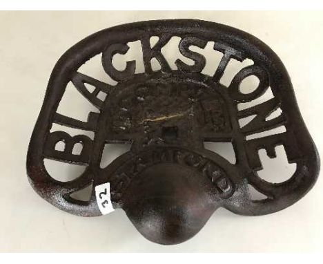 A cast metal Blackstone tractor seat