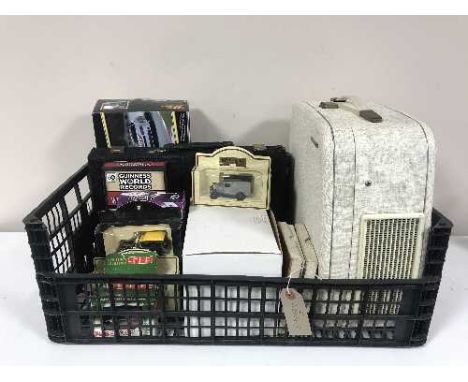 A basket of earthen ware tea and dinner set, Ringtons caddy, teapot, Spode cup etc and a basket of die cast vehicles, games, 