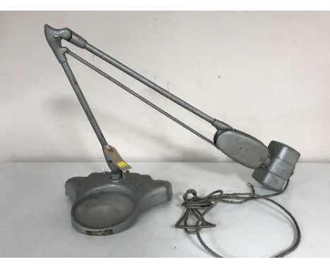 A mid 20th century industrial angle poise lamp with magnifying glass 