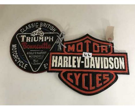 Two cast metal advertising signs - Triumph Bonneville and Harley Davidson cycles 