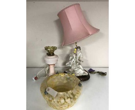 An Art Deco glass light fitting together with a cut glass table lamp with shade, a converted glass oil lamp and a figured 'lo