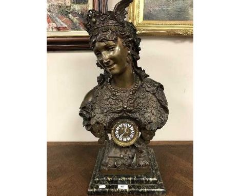 A patinated figural mantel clock with enamel dial, height 72cm