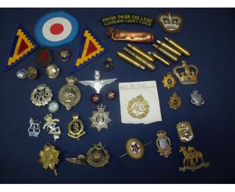 Various assorted inert ammunition, various cloth military arm badges, various cap badges including parachute regiments, milit