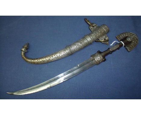 Early 19th C Moroccan Jambiya with 11 inch slightly curved double edged blade, scabbard and hilt covered with profusely decor