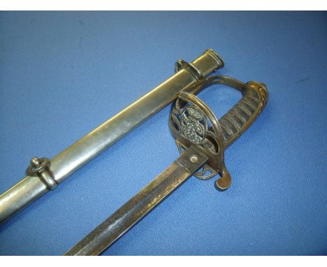 Victorian Officers dress sword with 32 1/2 inch straight single fullered blade with etched crowned VR and scrollwork detail a