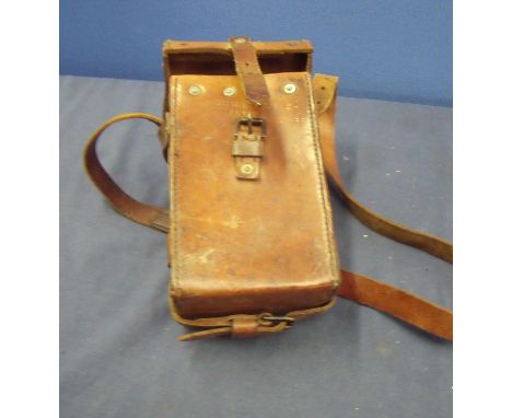 Tan leather .303 Vickers Gun P.I.1941 ammunition pouch, with broad arrow marks and carry strap with stamped detail 