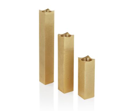 Francois de Gross,   Set of three engine turned candlesticks, circa 1970,  Gold plated metal,  Each stamped 'Francois de Gros